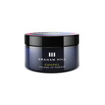 Volumengebende CHAPEL Volume Up Pomade von GRAHAM HILL in einer dunkelblauen 75-ml-Dose mit schwarzem Schraubdeckel.