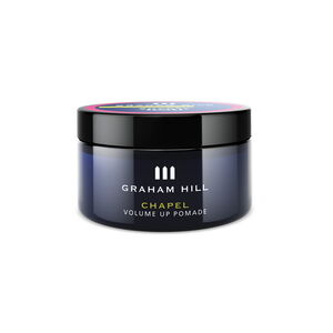 Volumengebende CHAPEL Volume Up Pomade von GRAHAM HILL in einer dunkelblauen 75-ml-Dose mit schwarzem Schraubdeckel.