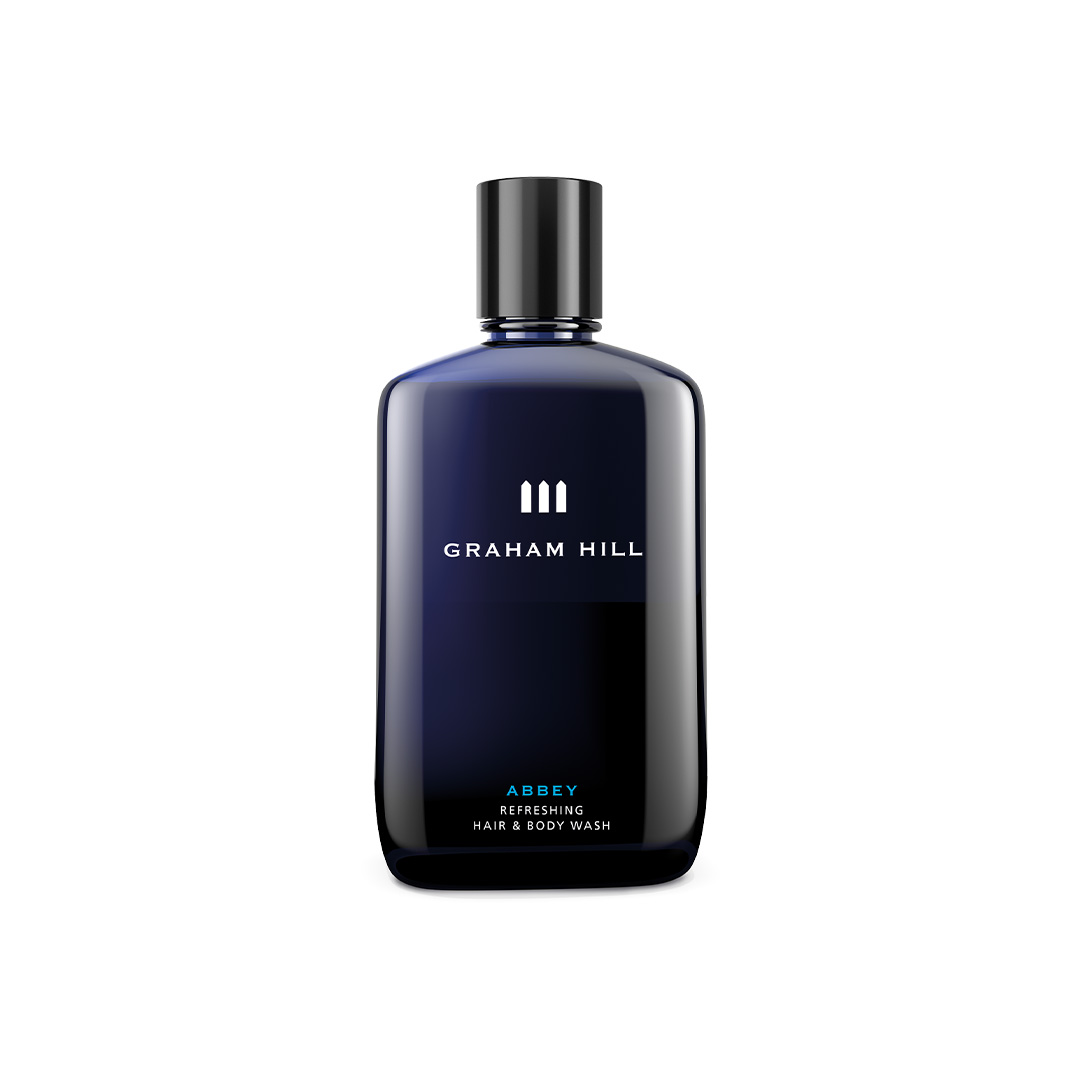 GRAHAM HILL ABBEY Refreshing Hair & Body Wash für Männer in einer dunkelblauen 250-ml-Flasche mit schwarzem Verschluss
